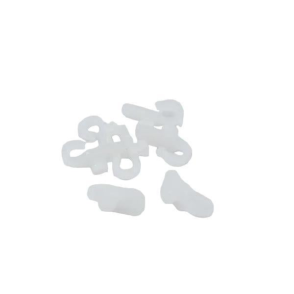 A small pile of translucent white plastic fastening or fastener pieces on a plain white background.