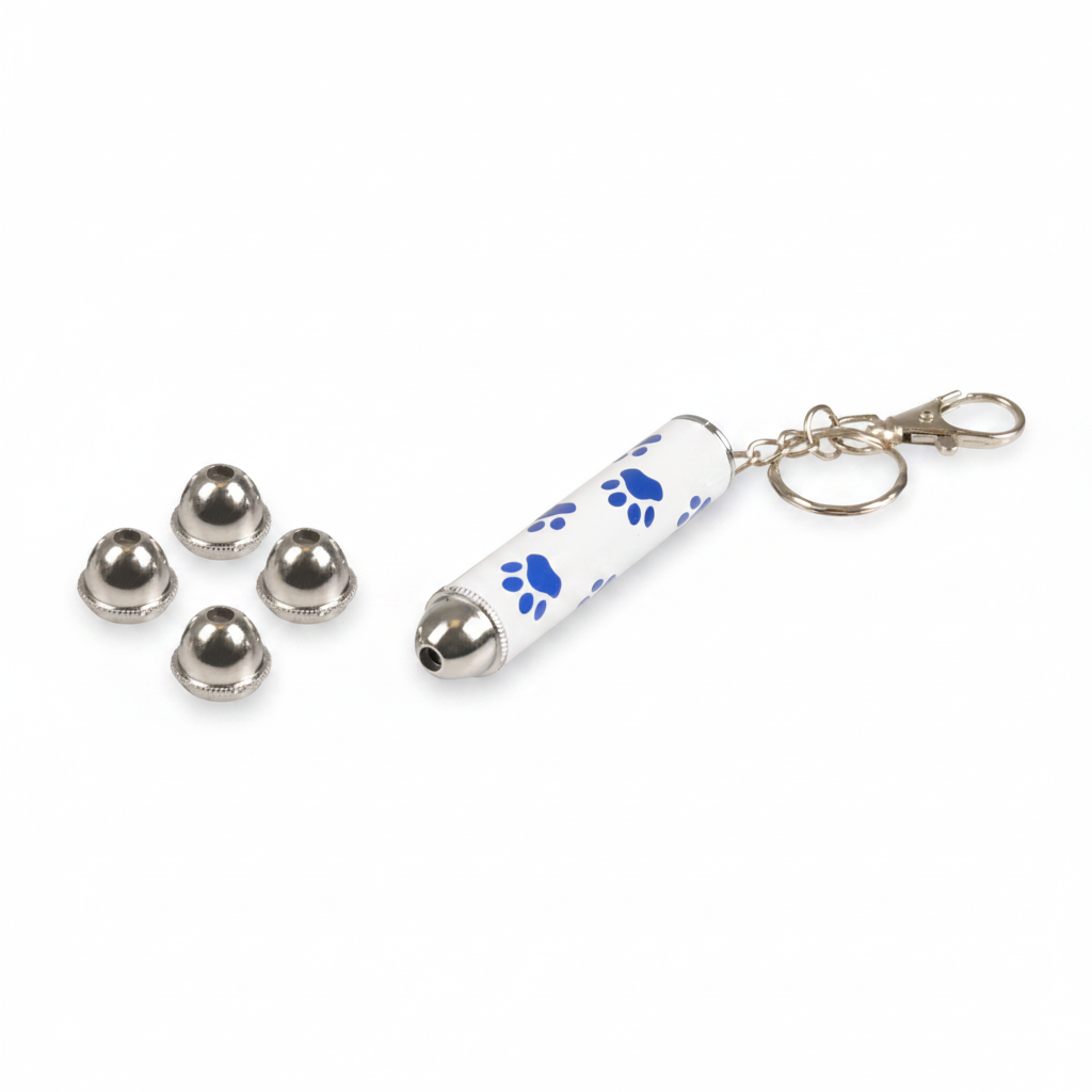 A white cylindrical keychain laser pen with blue paw print patterns and a silver metal bell, shown next to four small silver bell caps on a plain white background.