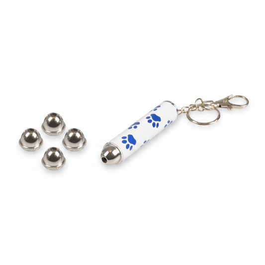 A white cylindrical keychain laser pen with blue paw print patterns and a silver metal bell, shown next to four small silver bell caps on a plain white background.