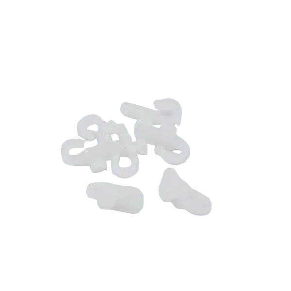 A small pile of translucent white plastic fastening or fastener pieces on a plain white background.