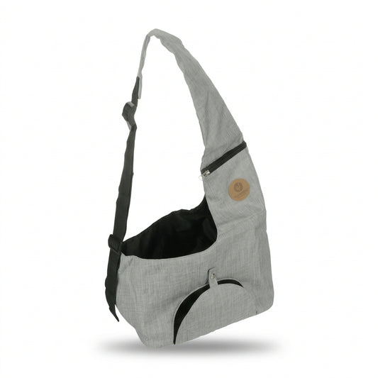 A light gray heathered fabric shoulder bag with black accents, including a black interior lining, a black curved trim detail, and a black adjustable strap. It features a small circular tan patch on the upper right side.