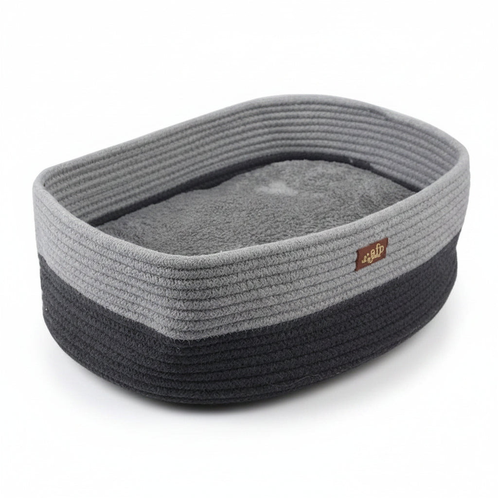 A gray and black rope pet bed with a soft gray cushion inside, shown with dimension lines and measurements indicating 30cm by 42cm by 14cm.