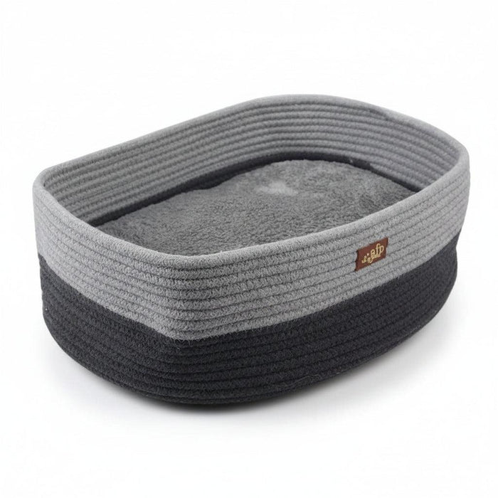 A gray and black rope pet bed with a soft gray cushion inside, shown with dimension lines and measurements indicating 30cm by 42cm by 14cm.