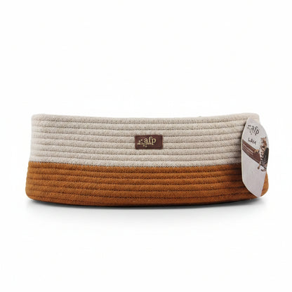 A rope-style pet cat bed by afp, featuring a cream top half and a rust-brown bottom half, with a hanging product tag on the right side.