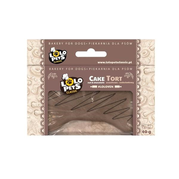 A packaged dog treat cake shaped like a tortilla chip, sealed in a clear plastic window package with a brown and beige label. The brand Lolo Pets Classic is clearly visible on the front.