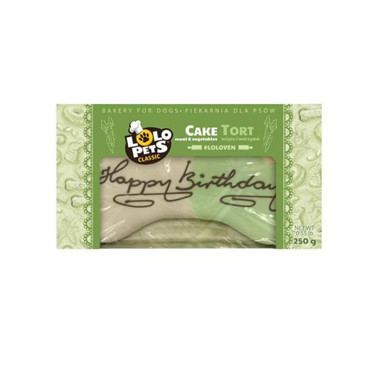 A packaged pet treat shaped like a tortilla chip, labeled 'Cake Tort' by Polo Pets Classics, with a green wrapper and a visible beige treat inside.