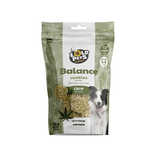 A package of Lolo Pets Classic Balance Calm dog cookies, featuring a green and white bag with a picture of a black and white dog and illustrations of the cookies inside.