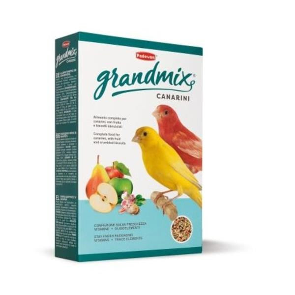 A box of Pedrin Grandmix Canarini bird feed, featuring illustrations of a yellow canary and a red canary on a light blue and white background with fruit graphics.