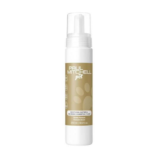 A white pump bottle of Paul Mitchell Pet Soothing Oatmeal De-shedding Shampoo with a beige label featuring a paw print design, on a solid white background.