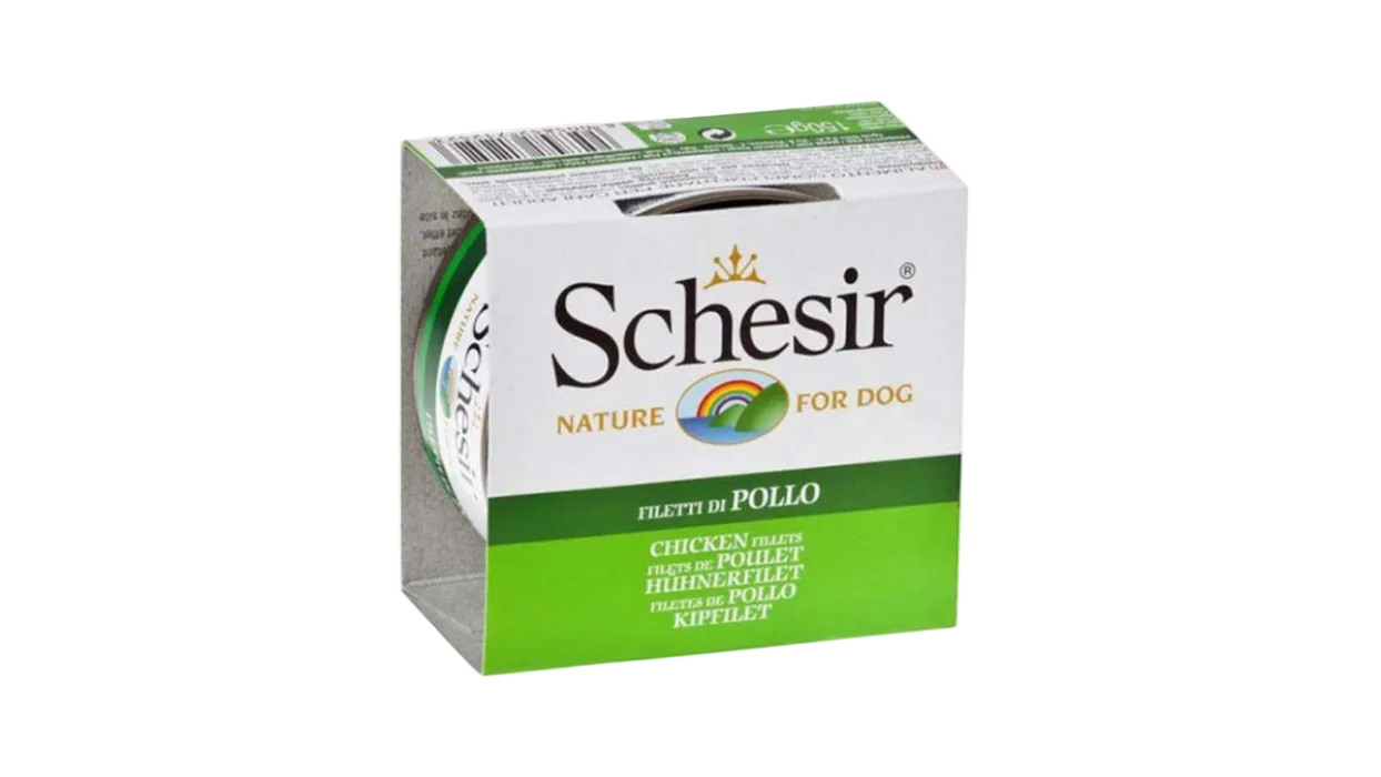 A pack of Schesir Nature for Dog chicken filletts in a white and green cardboard box, shown on a plain white background.