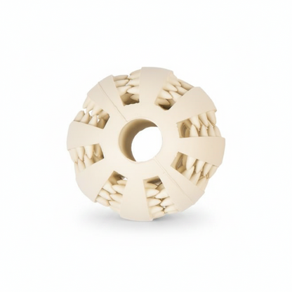 An off-white silicone dog chew toy with a central hole and textured, tooth-like segments around the outer ring, shown on a solid white background.