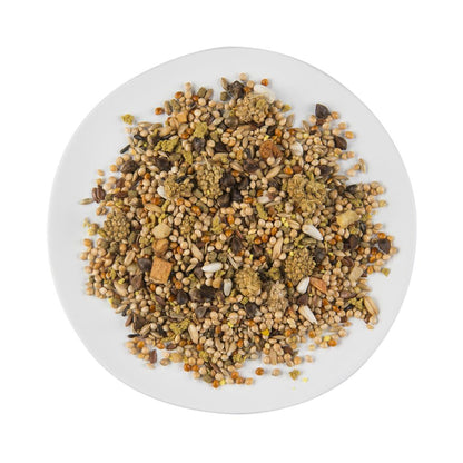 Puur Birdseed mix on a white plate with a white background