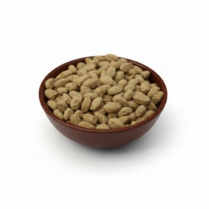 Brown ceramic bowl filled ZuPreem Parrot  food on a light gray background.