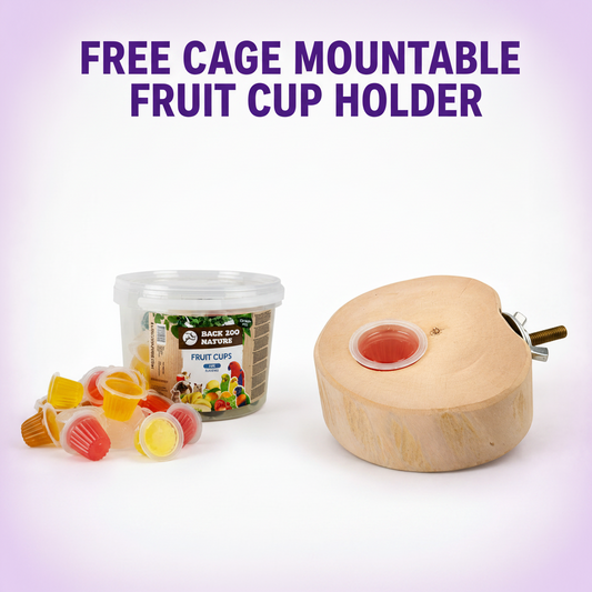 A promotional product image showing a heart-shaped wooden mount with a small cup holder slot, alongside a tub of fruit cups and loose colorful cups, with large text reading 'FREE CAGE MOUNTABLE FRUIT CUP HOLDER' on a pale lavender background.
