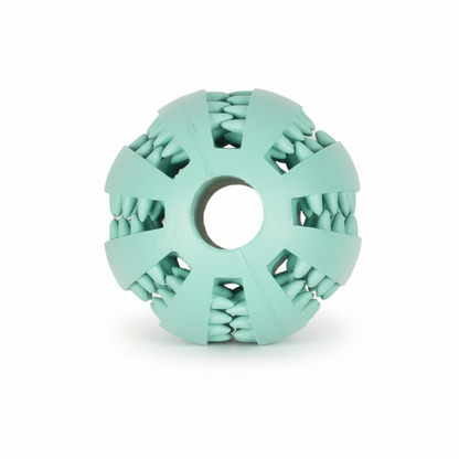 A mint green silicone dog toy with a textured, tooth-like outer surface and a circular hole in the center, shown on a plain white background.